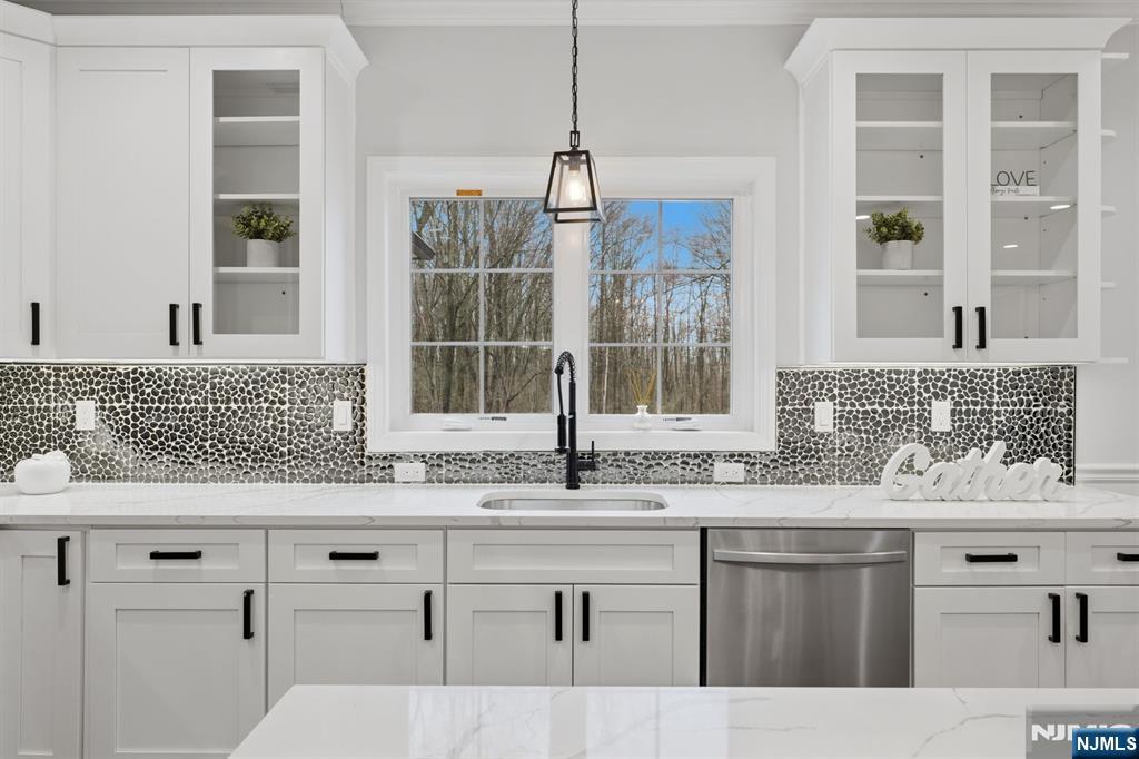 188 Edwards Road Parsippany, NJ 07054 - Photo 17 of 41 a kitchen with stainless steel appliances granite countertop a sink a window and cabinets