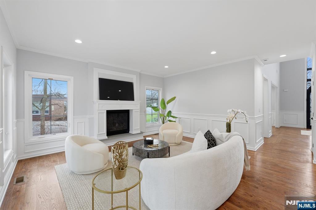 188 Edwards Road Parsippany, NJ 07054 - Photo 18 of 41 a living room with furniture a fireplace and a flat screen tv