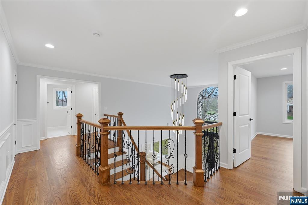 188 Edwards Road Parsippany, NJ 07054 - Photo 20 of 41 a view of a dining room and hall with wooden floor