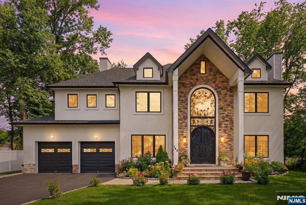 188 Edwards Road Parsippany, NJ 07054 - Photo 2 of 41 a front view of a house with a yard and garage