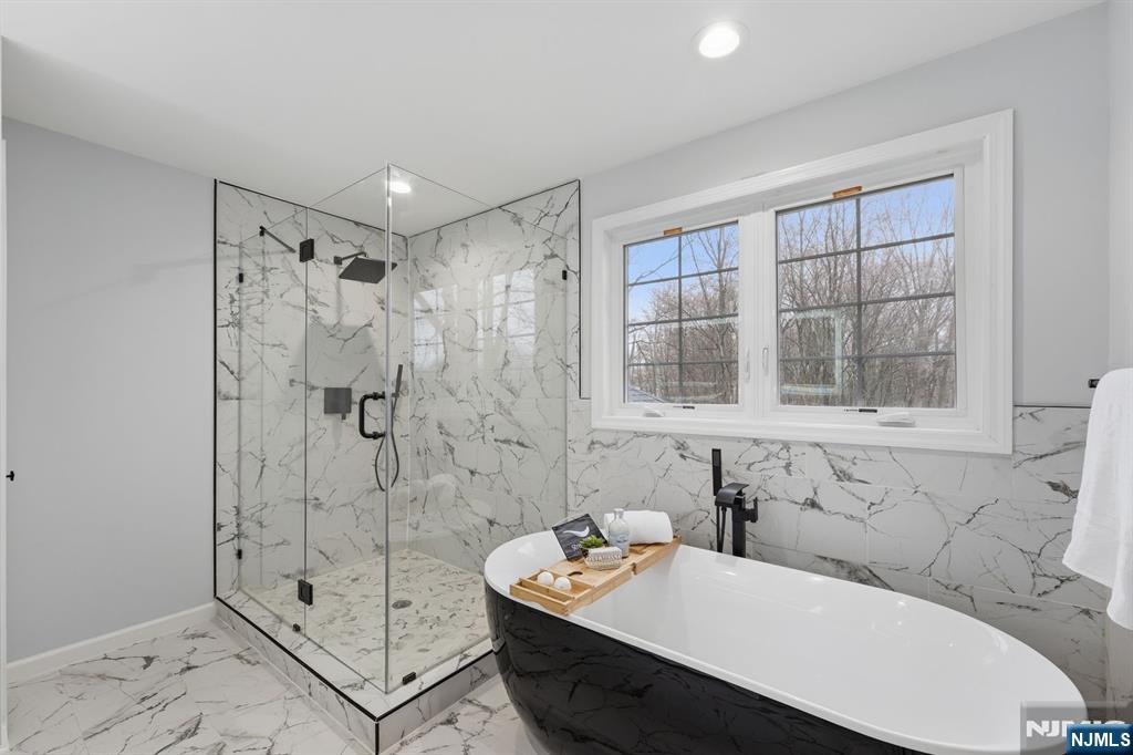 188 Edwards Road Parsippany, NJ 07054 - Photo 24 of 41 a bathroom with a tub sink and shower