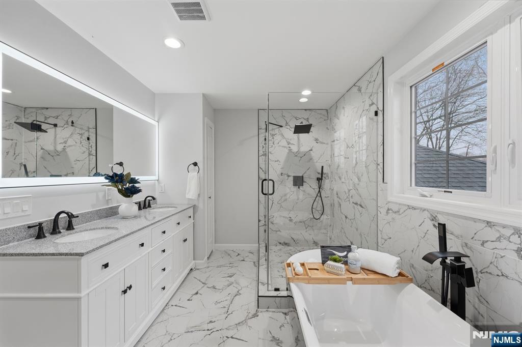 188 Edwards Road Parsippany, NJ 07054 - Photo 26 of 41 a bathroom with a tub sink and mirror