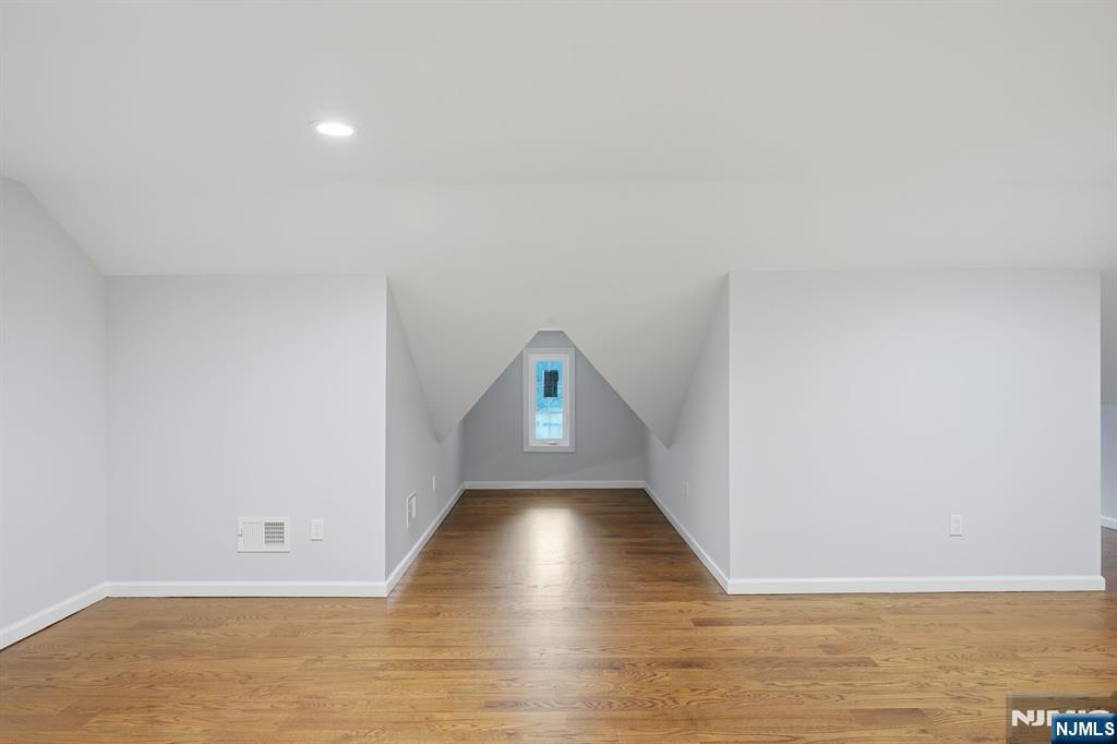 188 Edwards Road Parsippany, NJ 07054 - Photo 28 of 41 a view of an empty room with wooden floor and a window