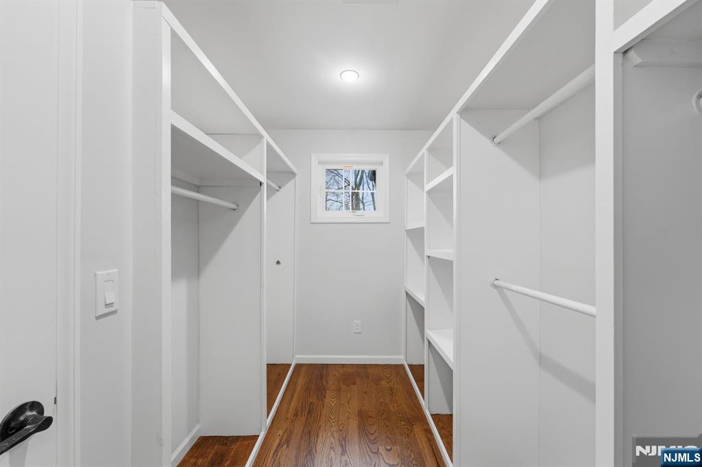 188 Edwards Road Parsippany, NJ 07054 - Photo 31 of 41 a view of hallway with stairs and wooden floor