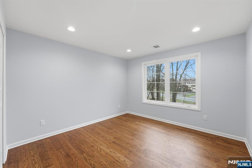 188 Edwards Road Parsippany, NJ 07054 - Photo 33 of 41 a view of an empty room with wooden floor and a window
