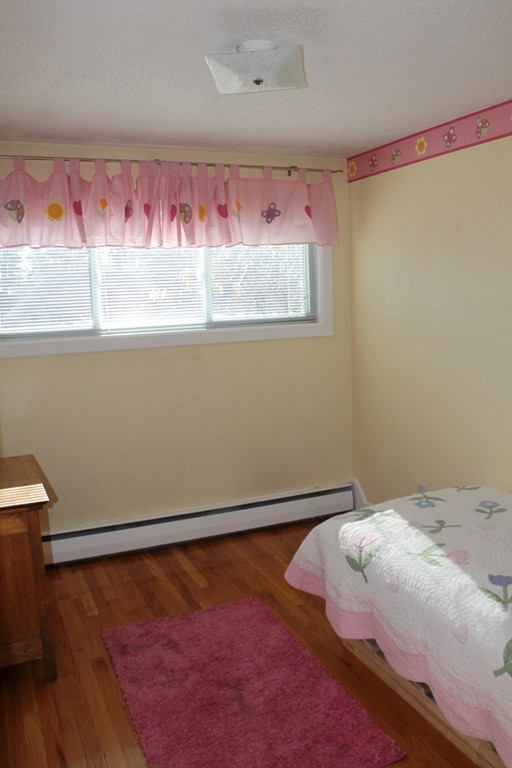 76 Brittany Road Springfield, MA 01151 - Photo 13 of 30 a bedroom with a bed and a window