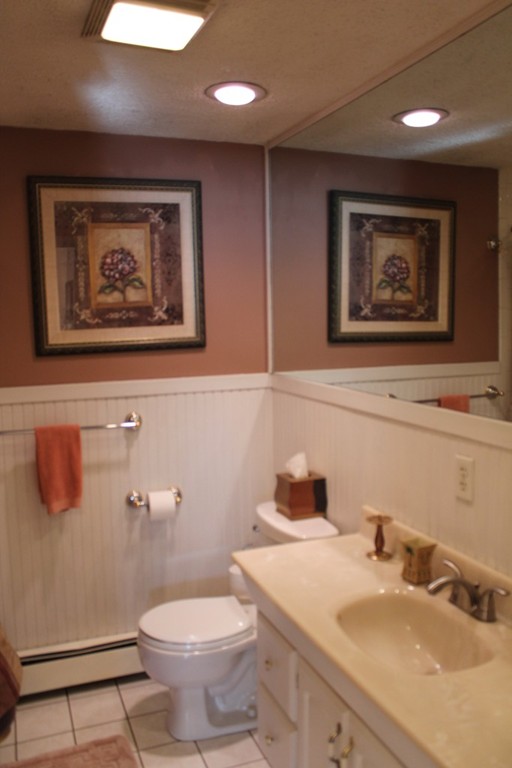 76 Brittany Road Springfield, MA 01151 - Photo 15 of 30 a bathroom with a toilet a sink and mirror