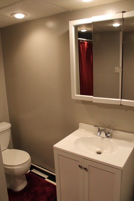 76 Brittany Road Springfield, MA 01151 - Photo 18 of 30 a bathroom with a sink mirror and toilet