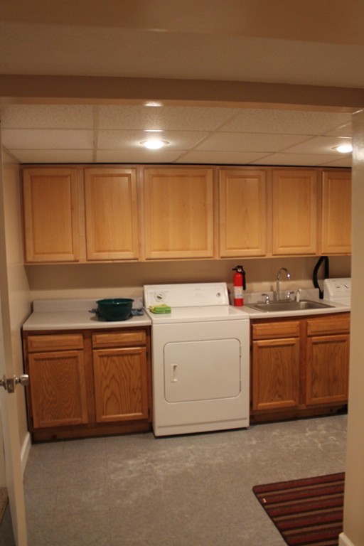 76 Brittany Road Springfield, MA 01151 - Photo 24 of 30 a utility room with sink dryer and washer