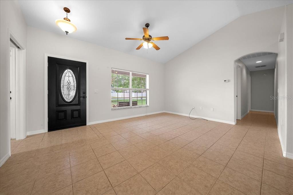 234 Locust Lane Ocala, FL 34472 - Photo 38 of 71 a view of a livingroom with a window and a ceiling fan