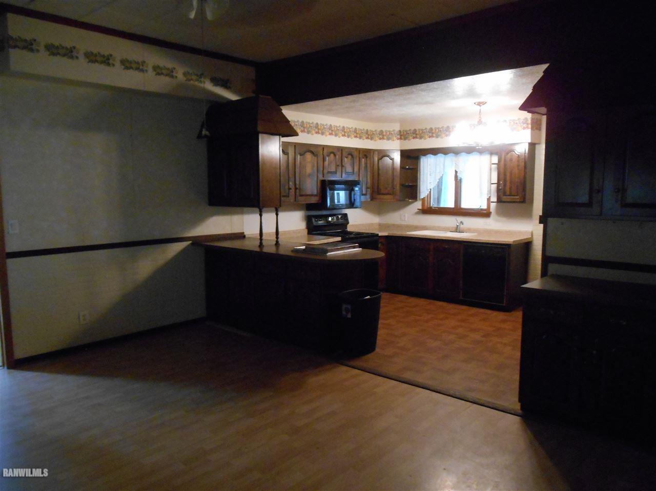 12960 Old Route Forreston, IL 61030 - Photo 4 of 21 a kitchen with a sink and cabinets