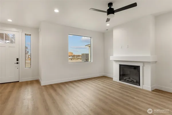 a kitchen with stainless steel appliances a refrigerator sink and microwave