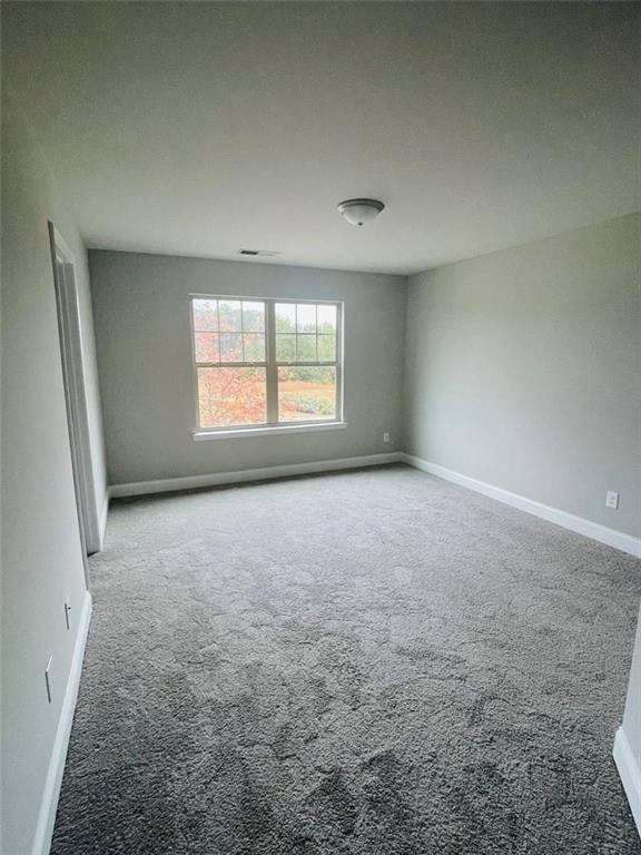 2325 Haliard Way Lithonia, GA 30058 - Photo 16 of 36 an empty room with windows