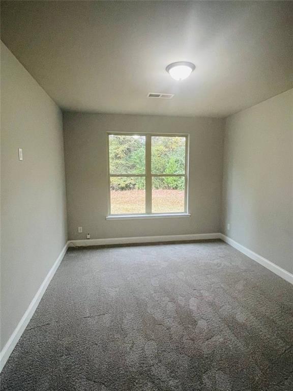 2325 Haliard Way Lithonia, GA 30058 - Photo 6 of 36 an empty room with a window