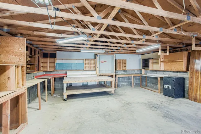 a front view of house with yard and trees in the background