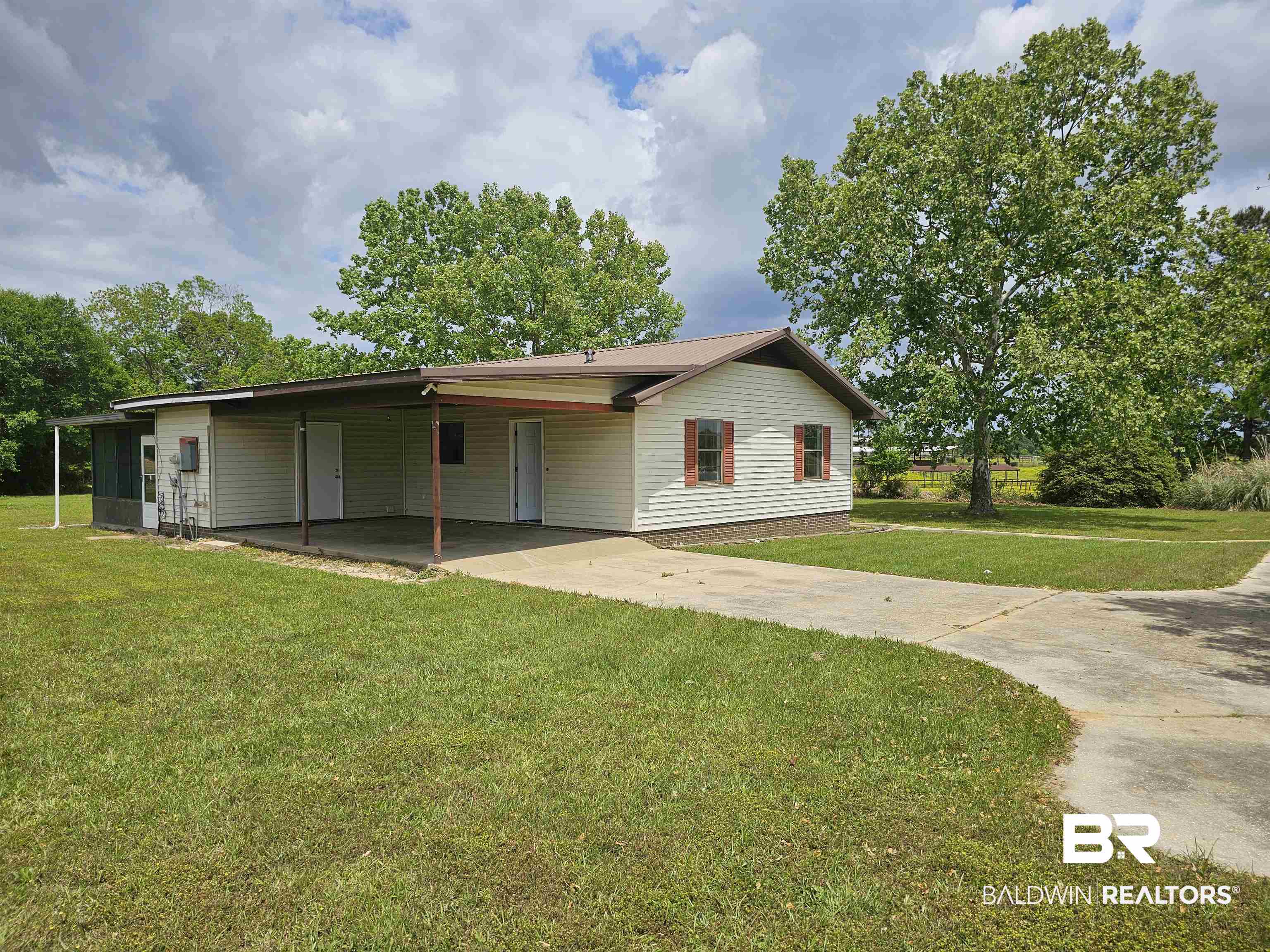59575 Lottie Road Atmore, AL 36502 - Photo 5 of 23 View of front of property featuring concrete driveway, a carport, and a front yard