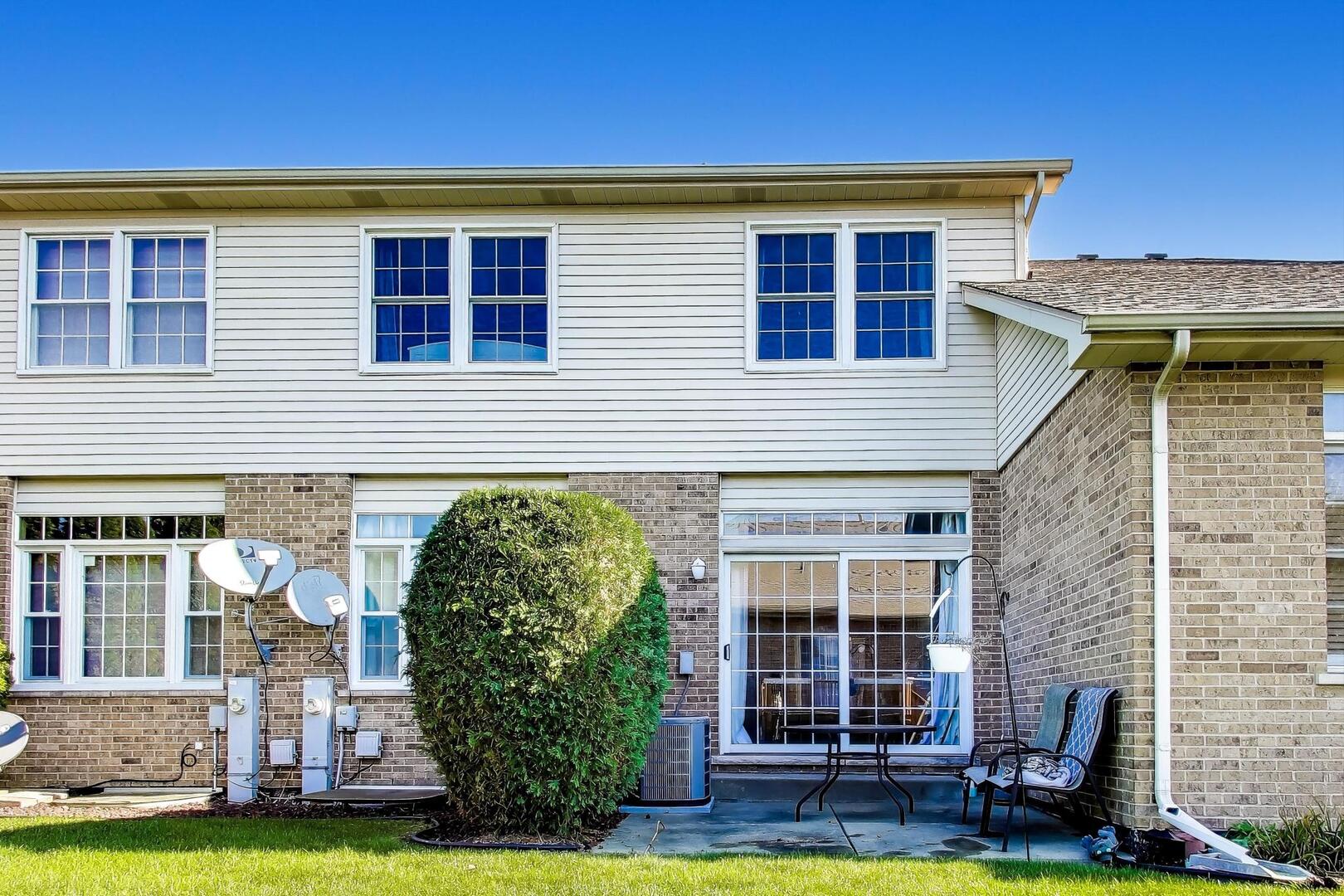 10521 Thornham Lane, Unit 10521 Mokena, IL 60448 - Photo 20 of 21 a view of a house with a yard