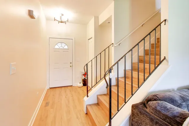 a view of entryway with wooden floor