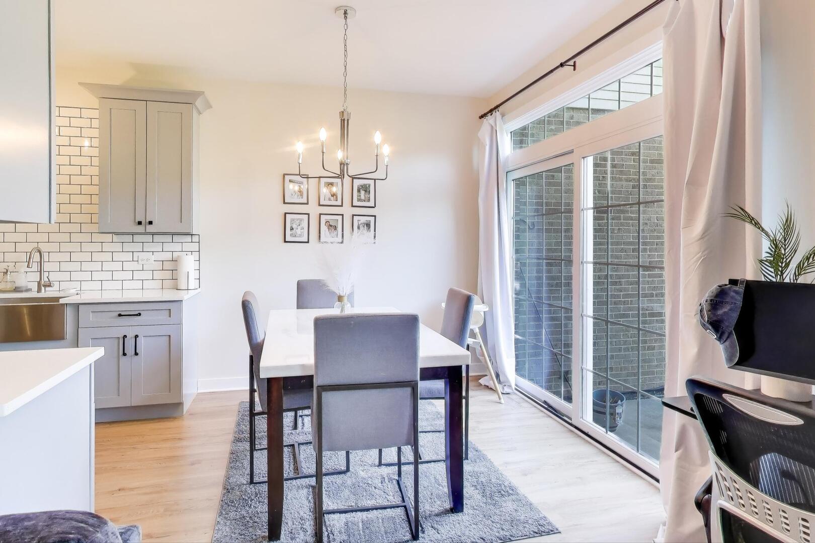 10521 Thornham Lane, Unit 10521 Mokena, IL 60448 - Photo 6 of 21 a view of a dining room with furniture window and wooden floor