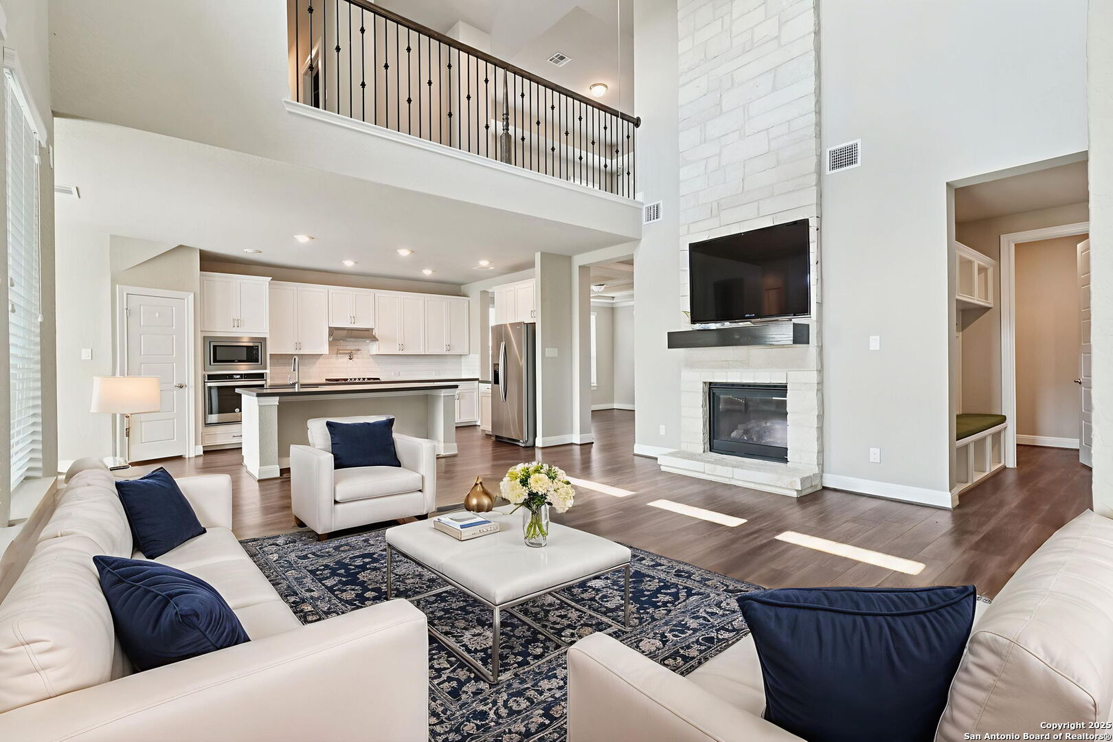 2622 Raven Ridge Point San Antonio, TX 78259 - Photo 12 of 53 a living room with furniture a fireplace and a flat screen tv