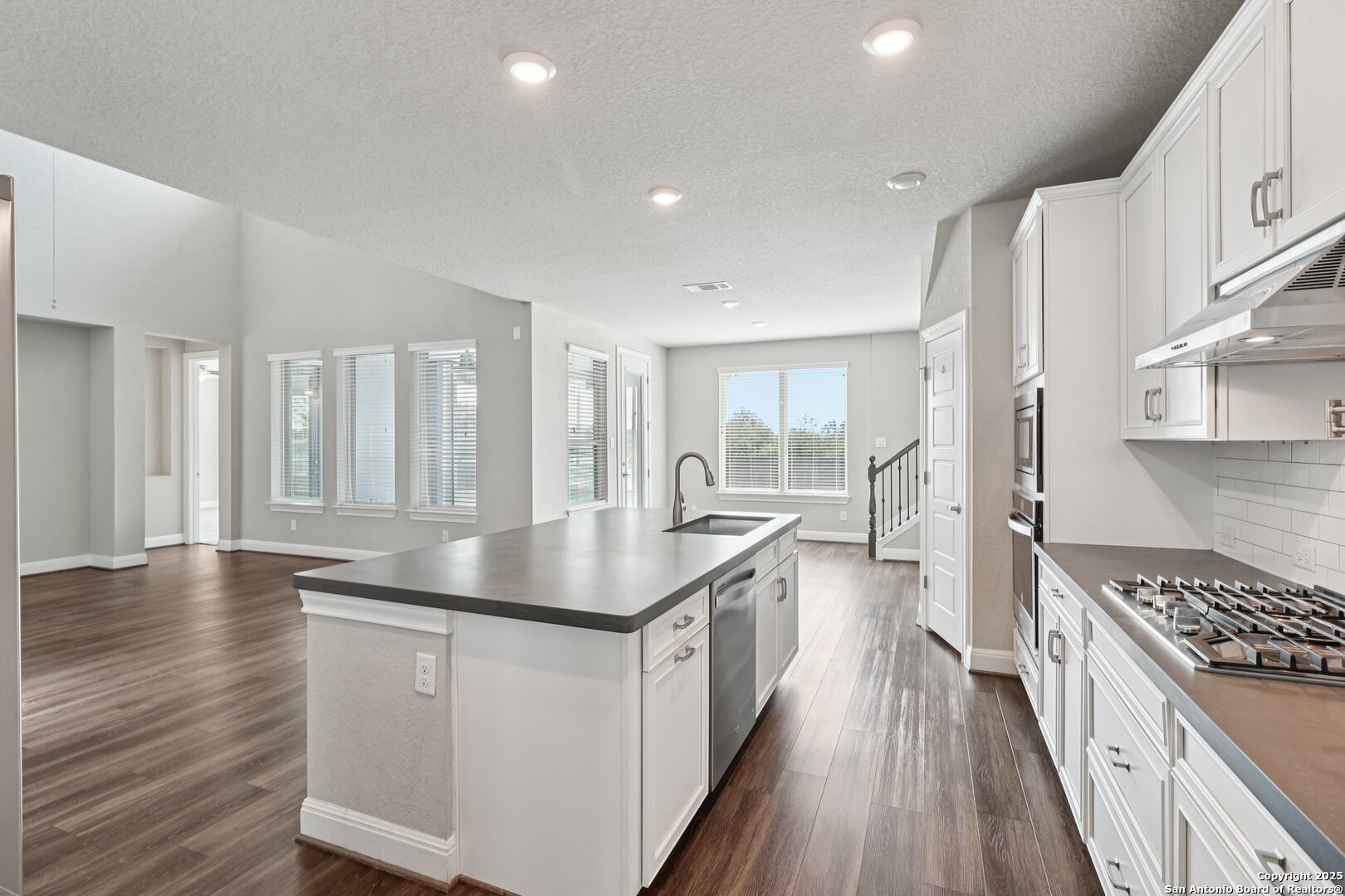 2622 Raven Ridge Point San Antonio, TX 78259 - Photo 16 of 53 a kitchen with counter top space a sink appliances and cabinets