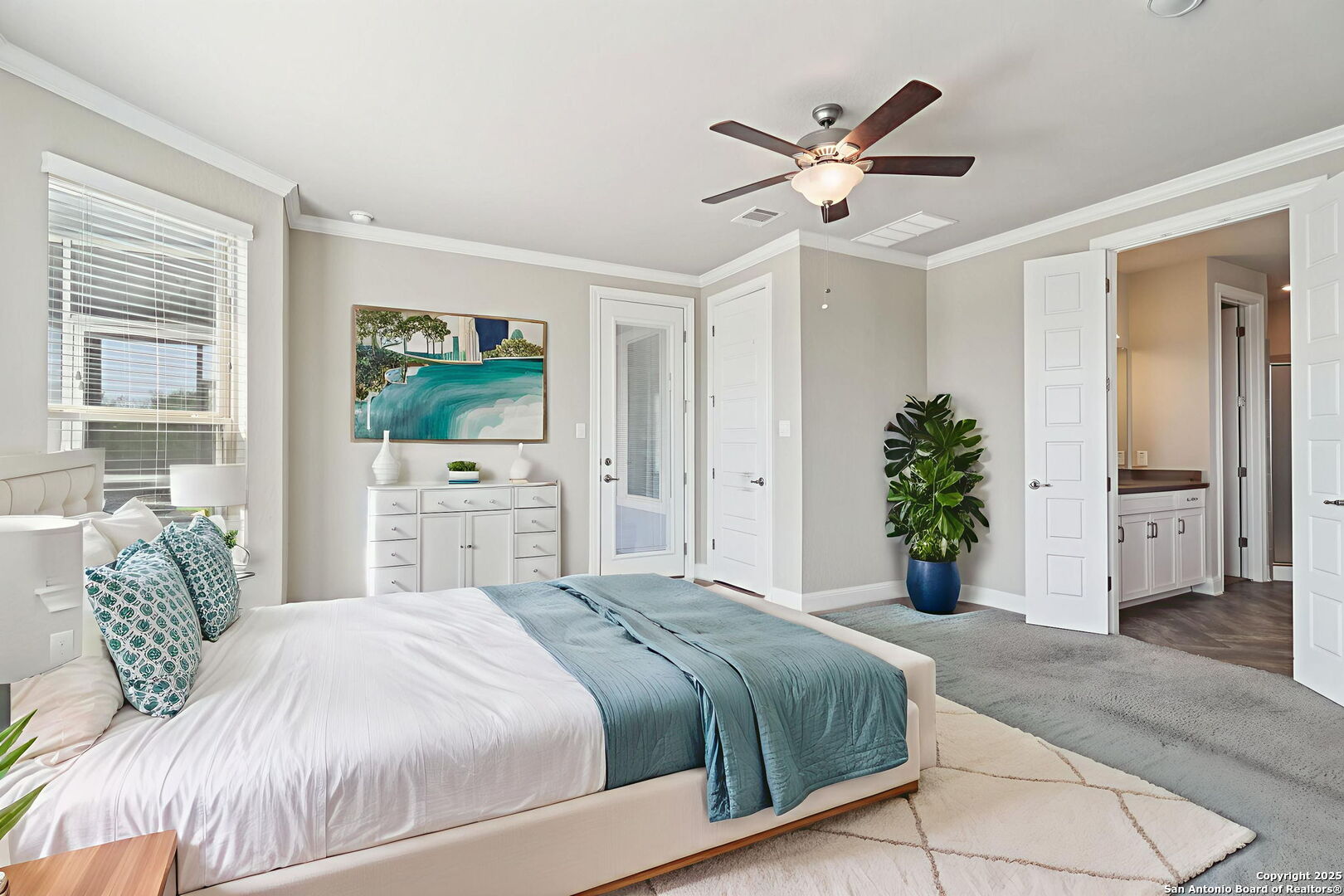2622 Raven Ridge Point San Antonio, TX 78259 - Photo 23 of 53 a bedroom with a large bed potted plant and a large window