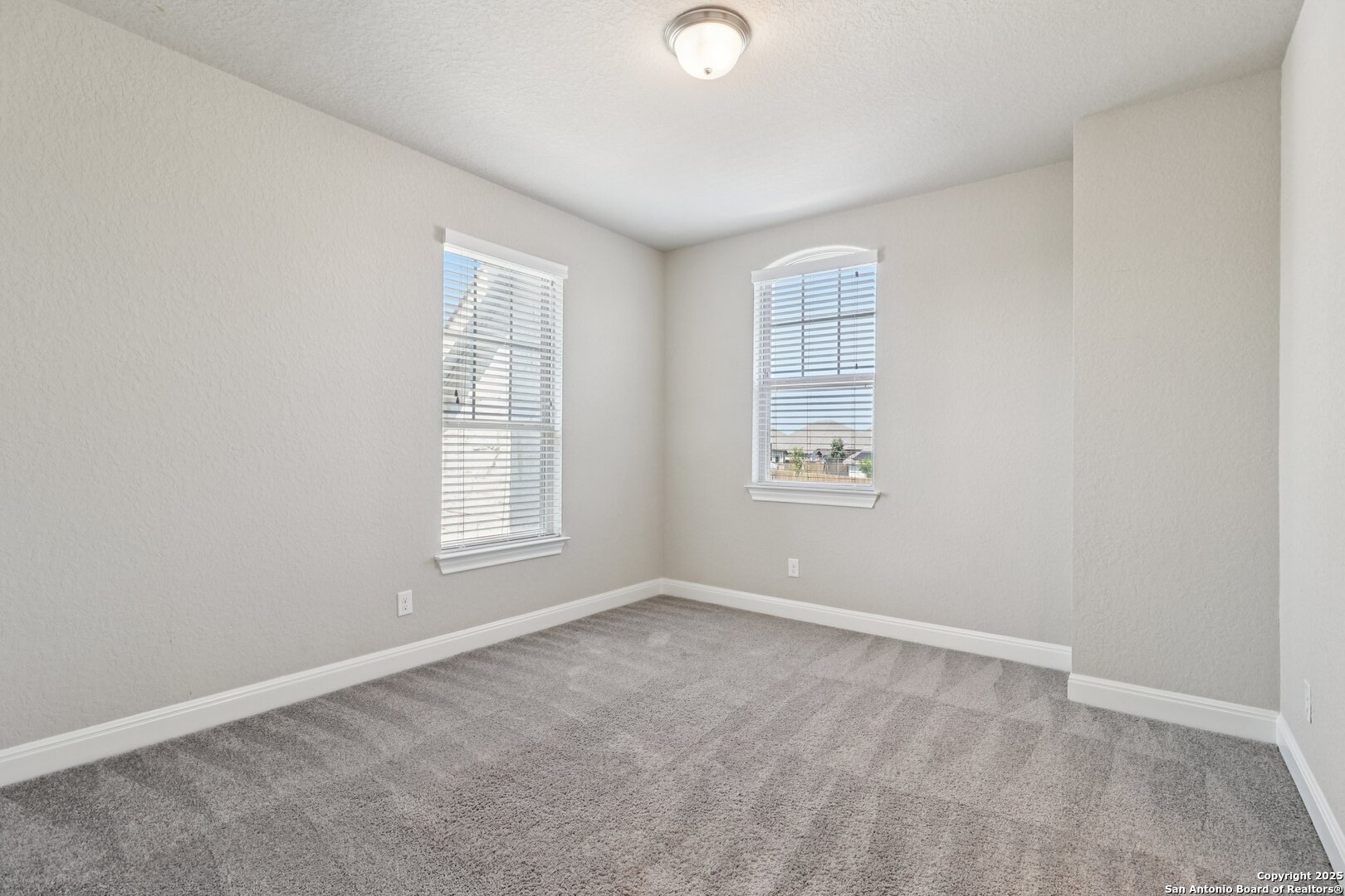 2622 Raven Ridge Point San Antonio, TX 78259 - Photo 31 of 53 an empty room with windows