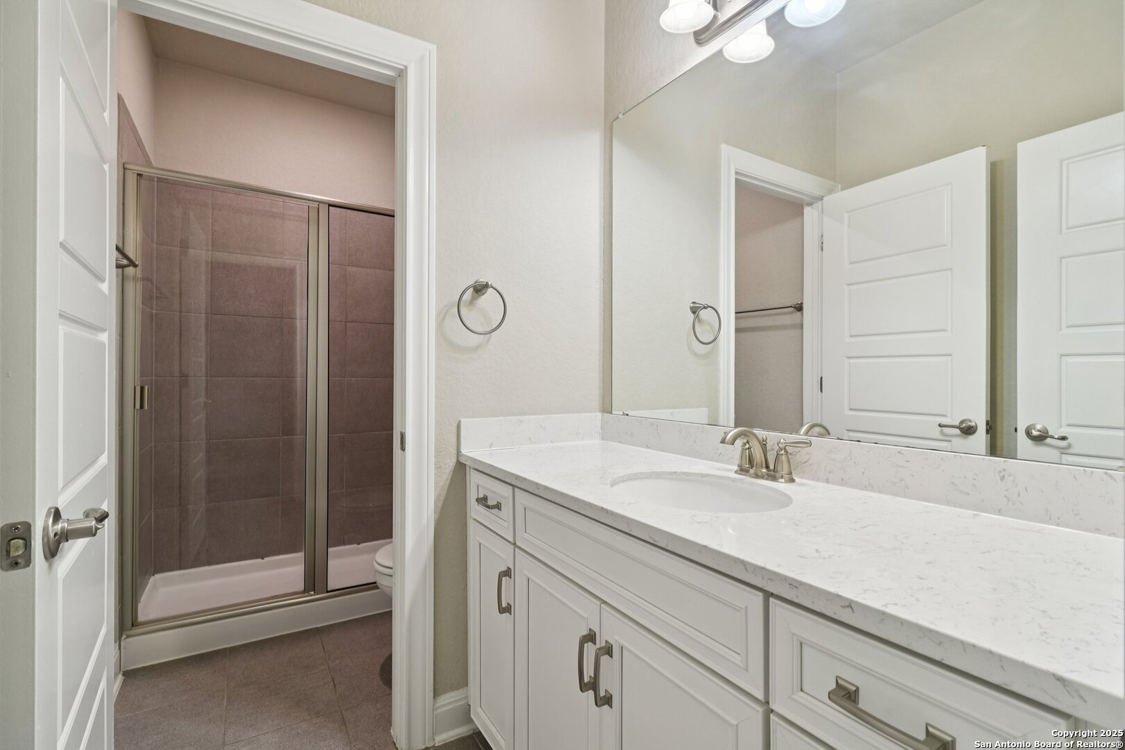 2622 Raven Ridge Point San Antonio, TX 78259 - Photo 37 of 53 a bathroom with a sink and a mirror