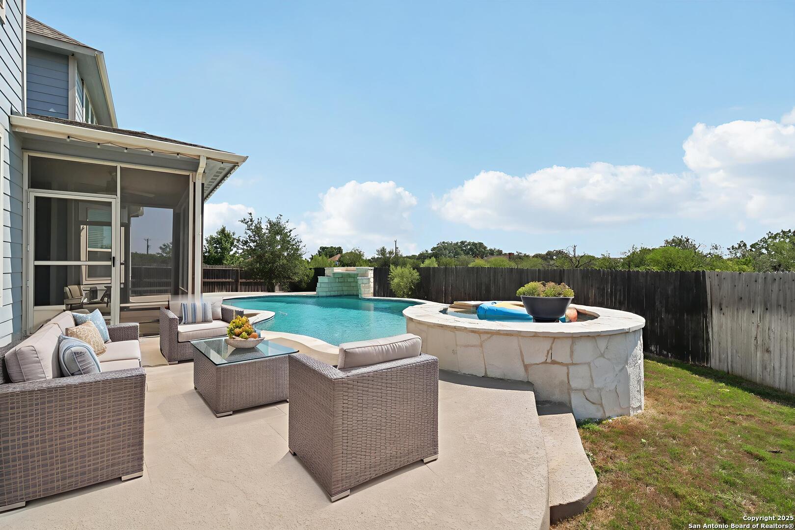 2622 Raven Ridge Point San Antonio, TX 78259 - Photo 4 of 53 a view of a swimming pool with couches and city view