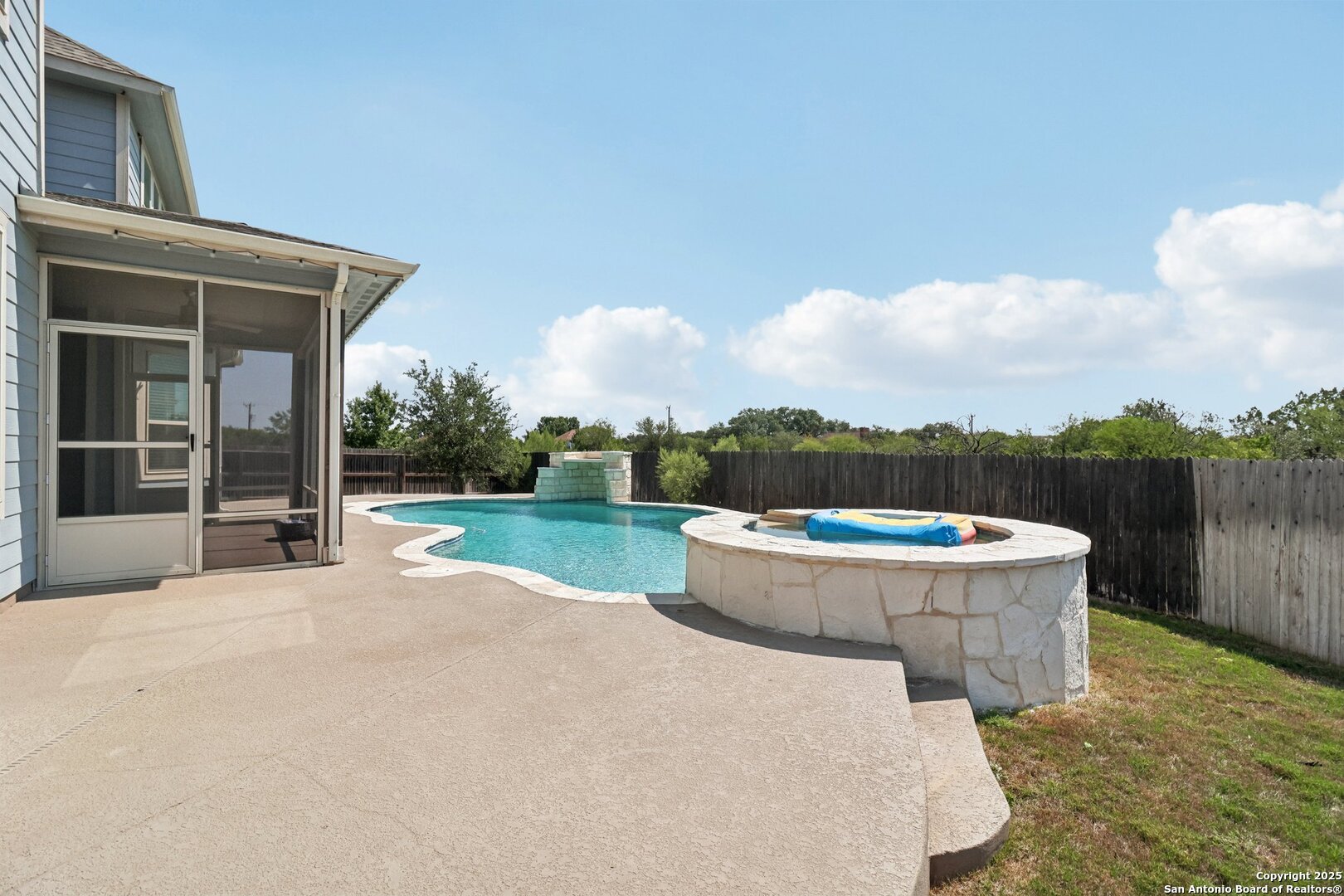 2622 Raven Ridge Point San Antonio, TX 78259 - Photo 8 of 53 a view of a backyard with fountain plants and large tree