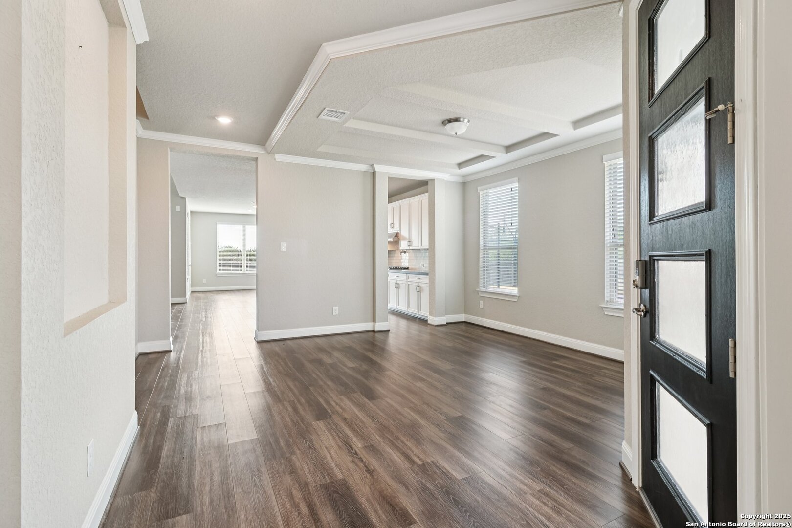 2622 Raven Ridge Point San Antonio, TX 78259 - Photo 9 of 53 a view of an empty room with wooden floor and a window