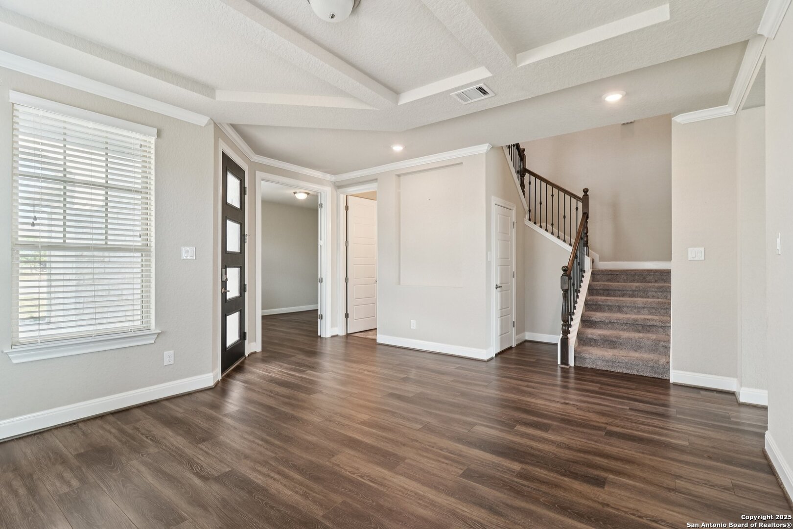 2622 Raven Ridge Point San Antonio, TX 78259 - Photo 10 of 53 an empty room with wooden floor and windows