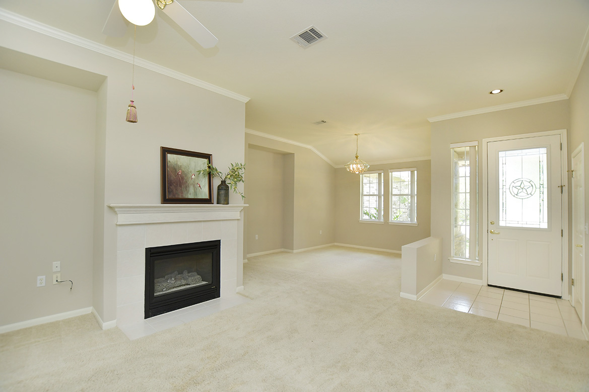 114 Lone Star Drive Georgetown, TX 78633 - Photo 9 of 30 The single living area features a cozy gas fireplace - available at the flip of a switch.