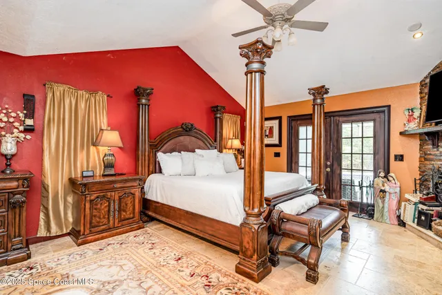 a bedroom with furniture and a chandelier