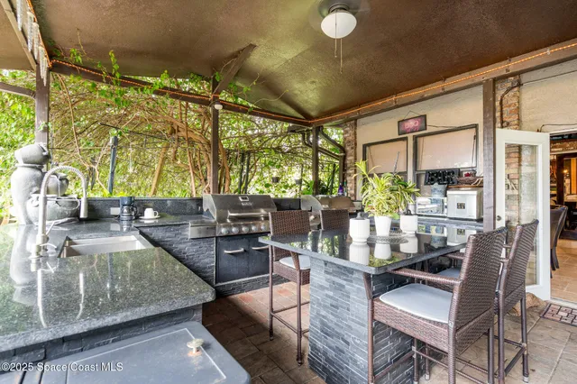 a dining room with furniture and a large window