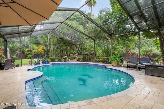 a view of a swimming pool with a patio
