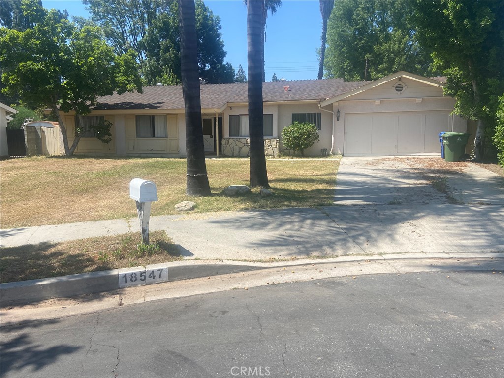 18547 Clymer Street Porter Ranch, CA 91326 - Photo 1 of 1 a front view of a house with a yard
