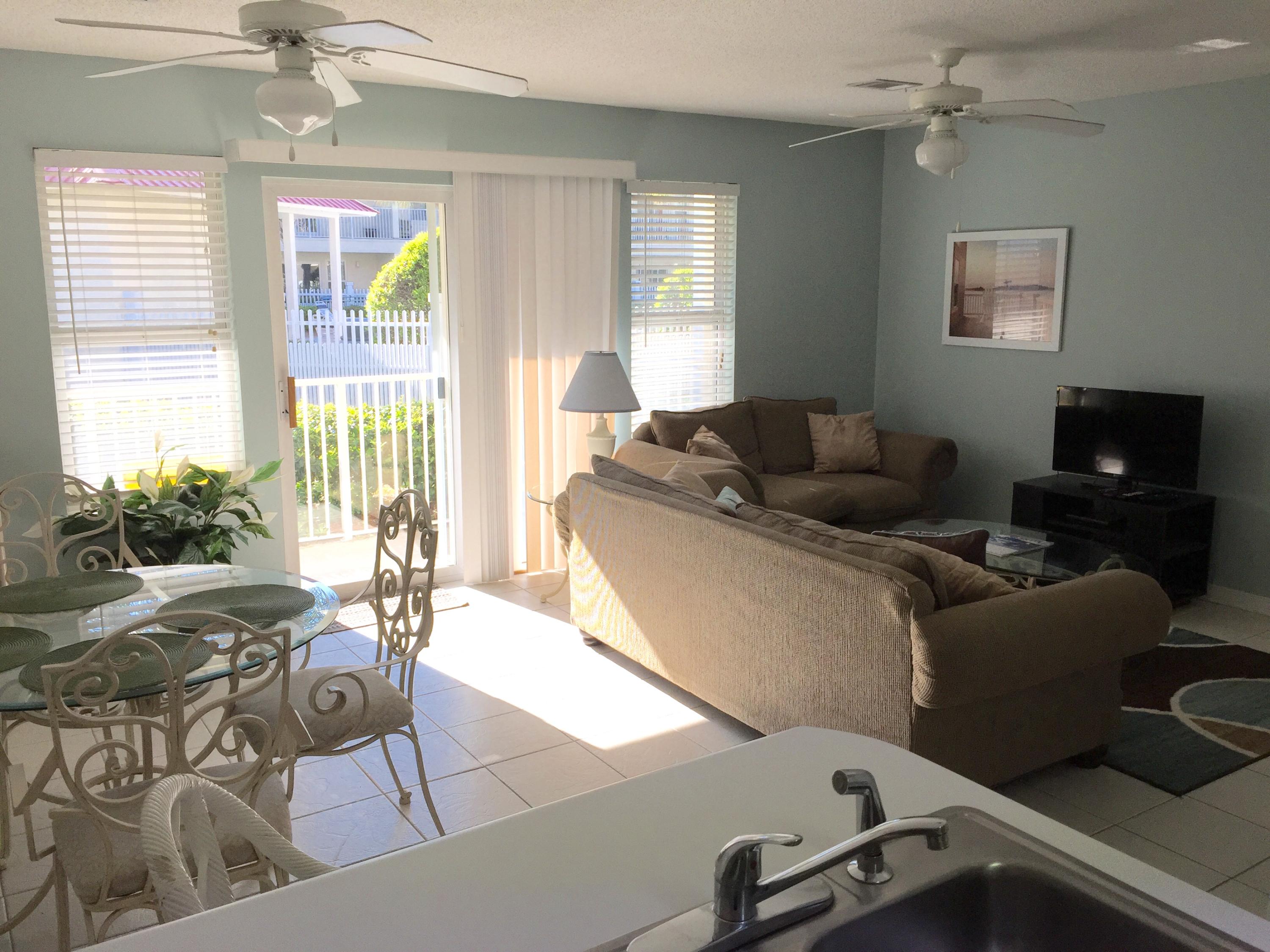 82 Sugar Sand Lane, Unit C1 Santa Rosa Beach, FL 32459 - Photo 3 of 13 a living room with furniture and a flat screen tv