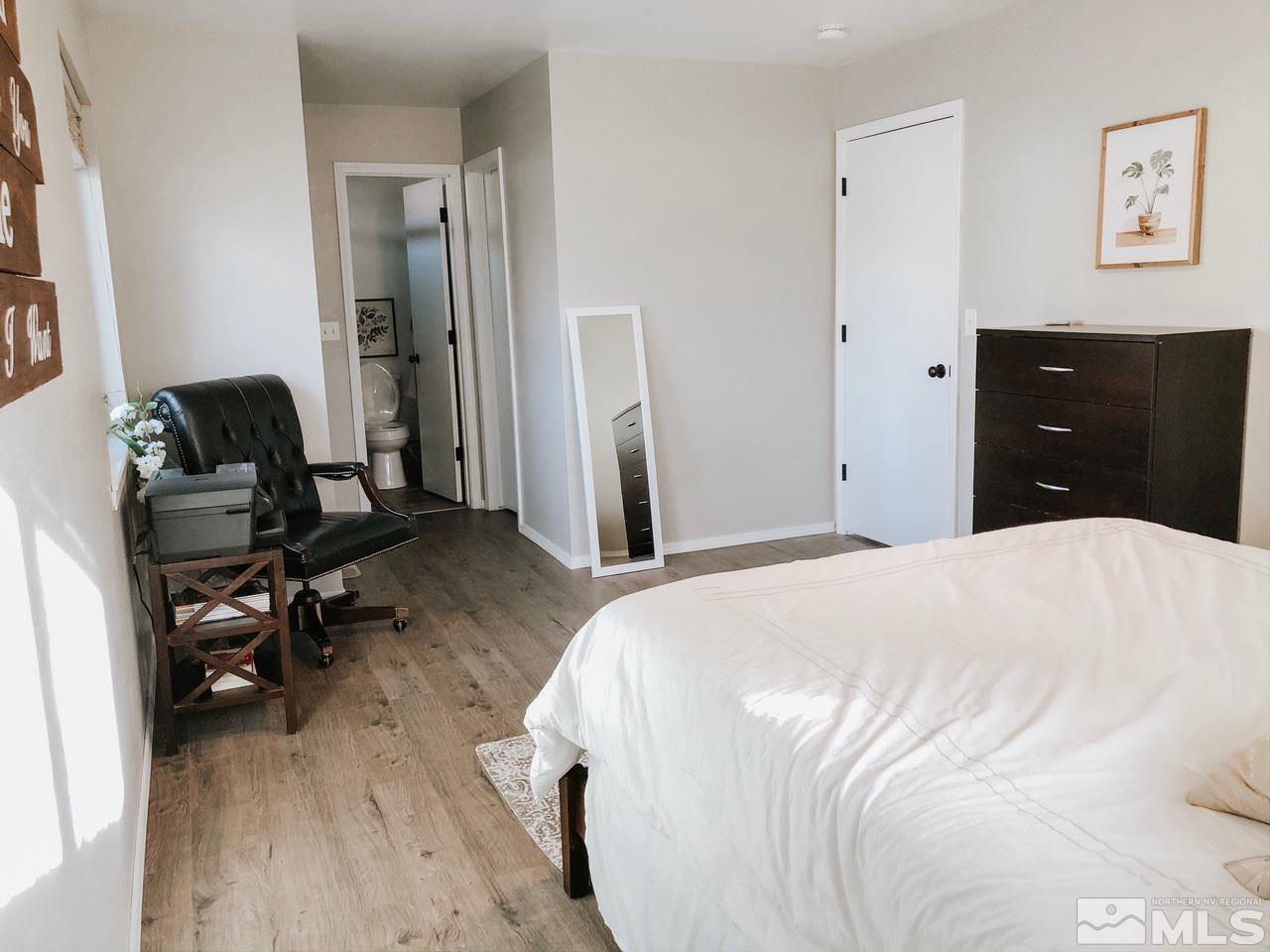 357 Lewis Lane Fallon, NV 89406 - Photo 19 of 22 a bedroom with a bed and a dresser
