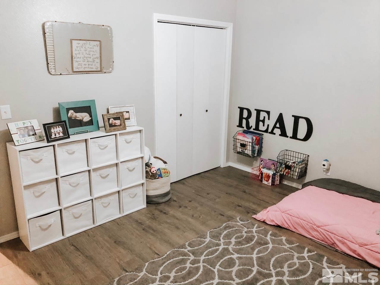 357 Lewis Lane Fallon, NV 89406 - Photo 22 of 22 a bedroom with a bed and a cabinets