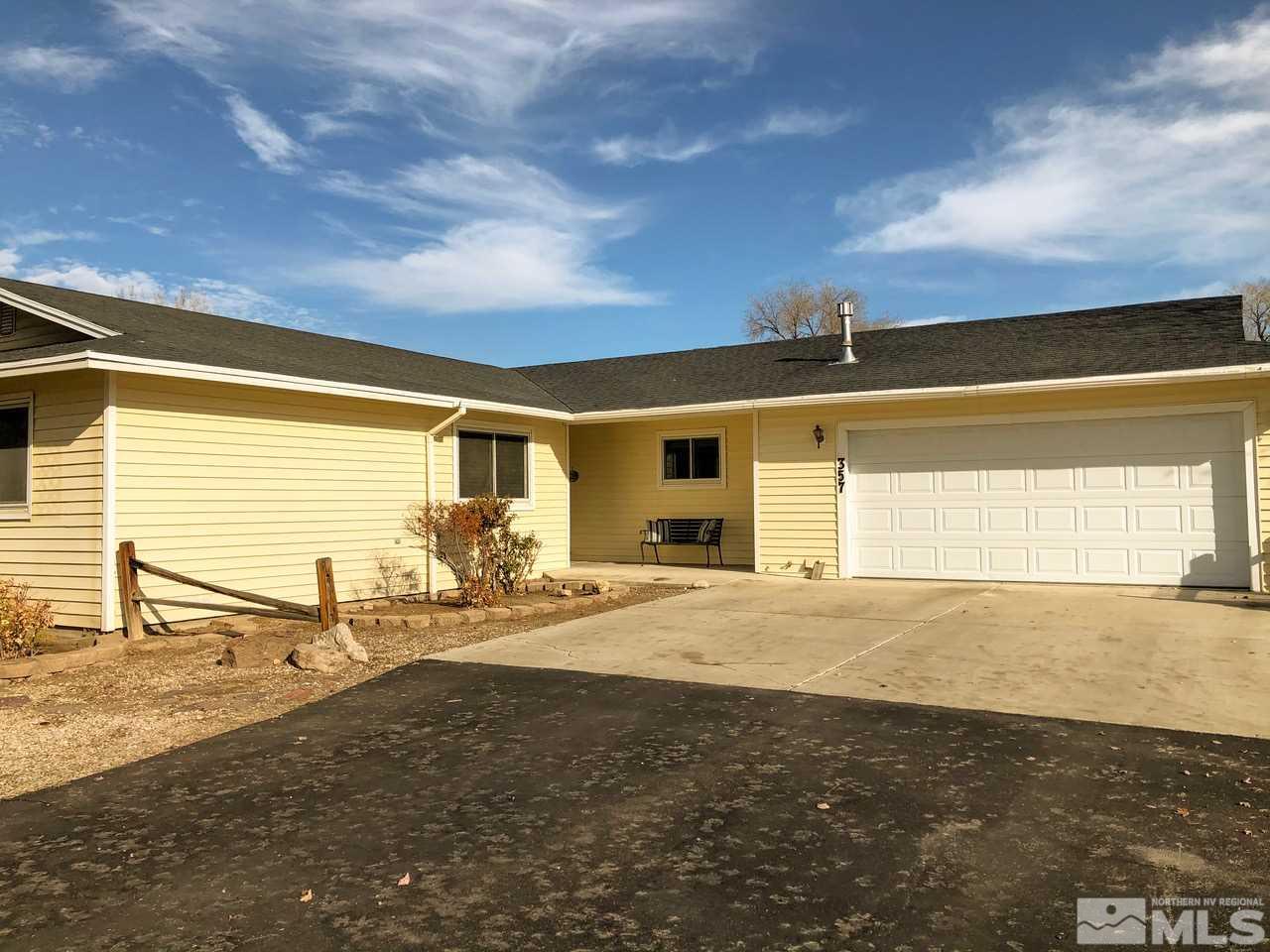 357 Lewis Lane Fallon, NV 89406 - Photo 5 of 22 a view of a patio with table and chairs and floor to ceiling window