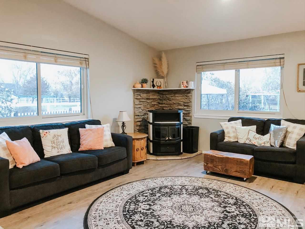357 Lewis Lane Fallon, NV 89406 - Photo 8 of 22 a living room with furniture and a fireplace
