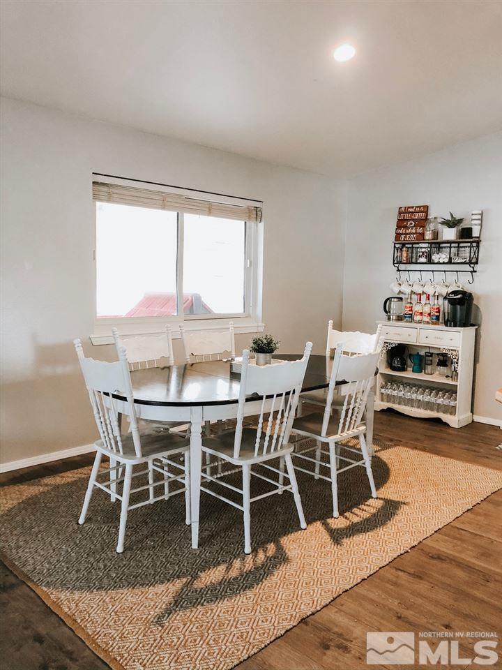 357 Lewis Lane Fallon, NV 89406 - Photo 10 of 22 a dining room with furniture window and wooden floor
