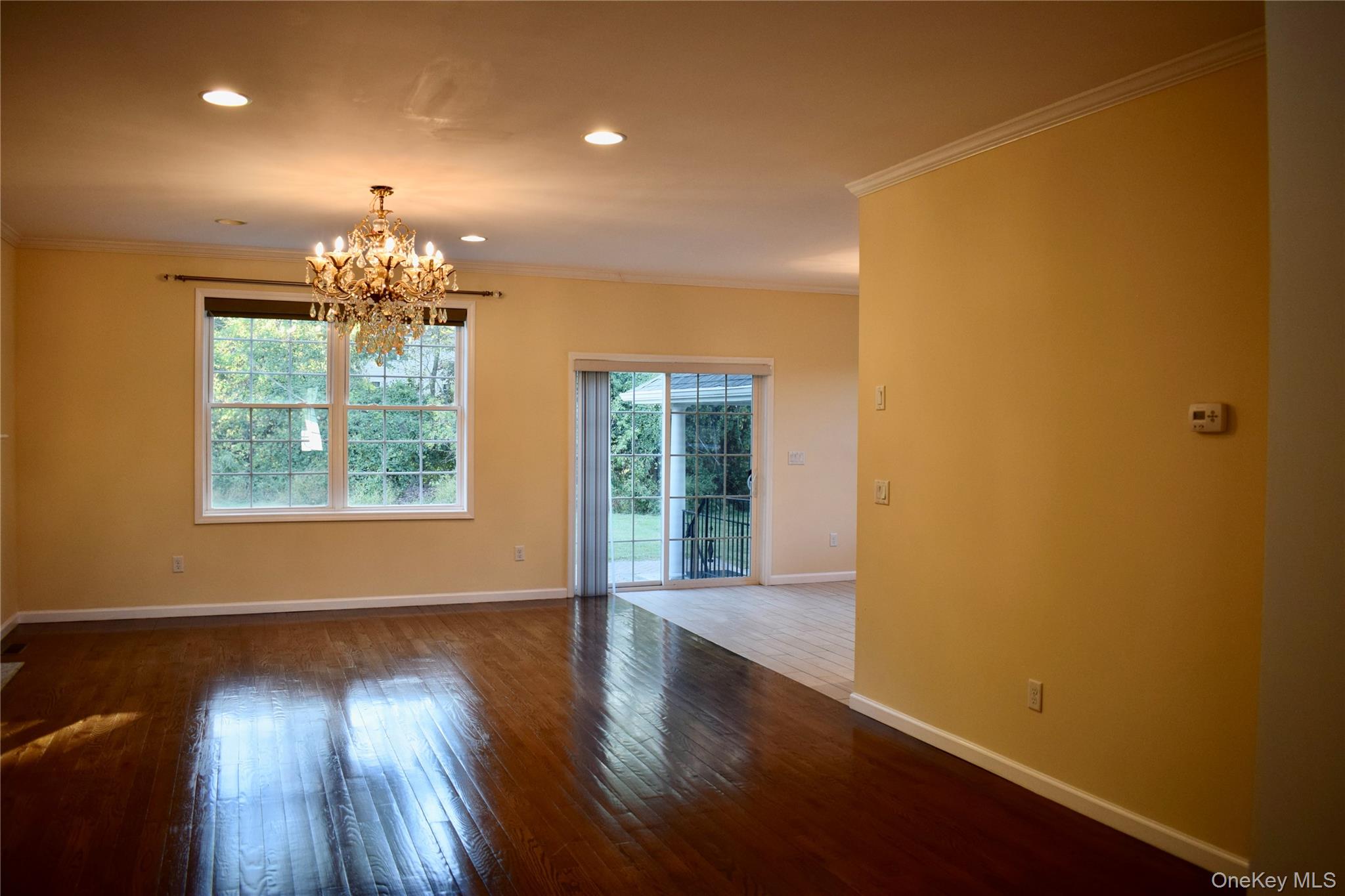 9 Alia Court Poughkeepsie, NY 12603 - Photo 12 of 37 a view of a room with wooden floor and chandelier