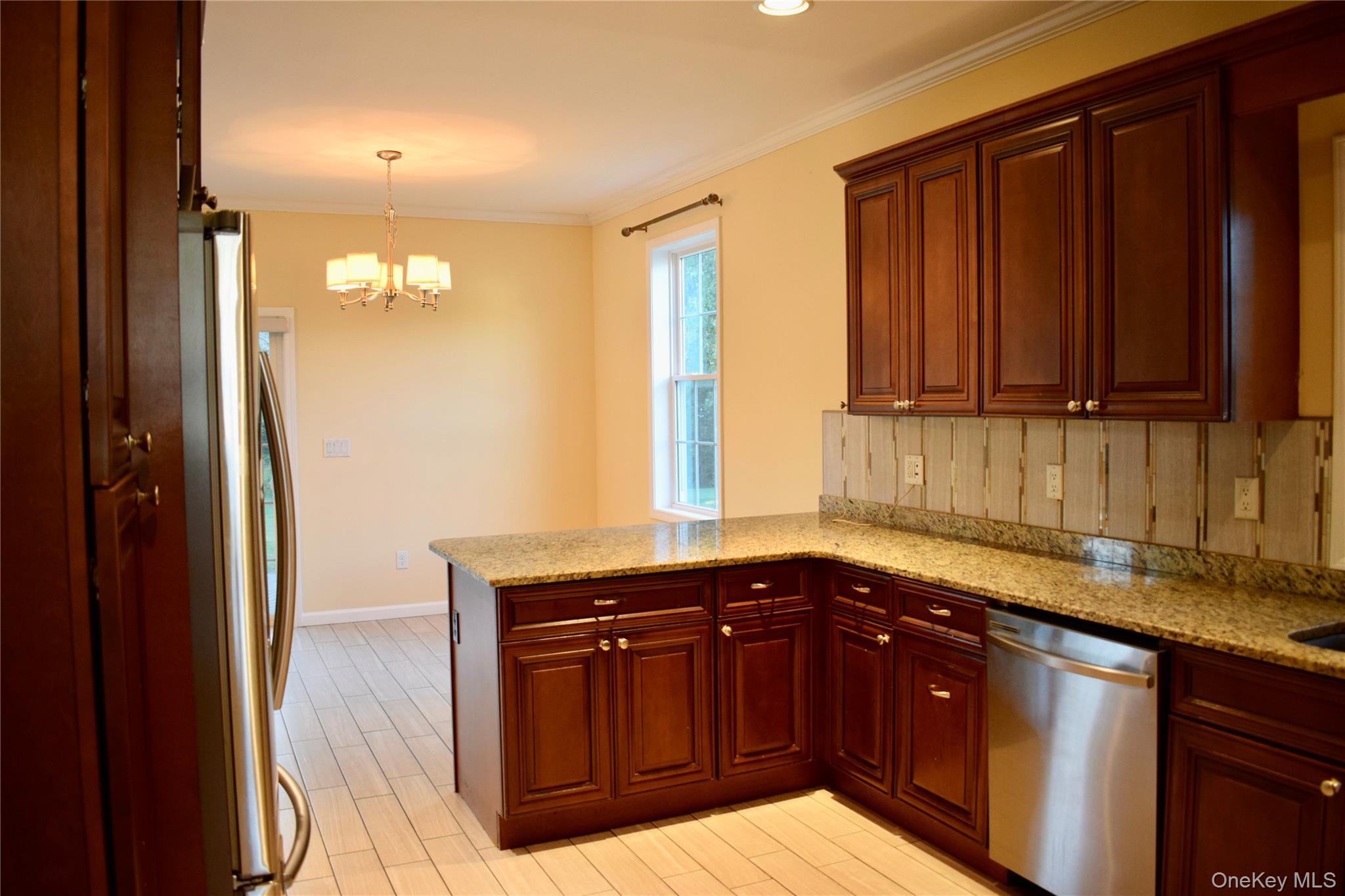 9 Alia Court Poughkeepsie, NY 12603 - Photo 14 of 37 a kitchen with granite countertop a sink and cabinets