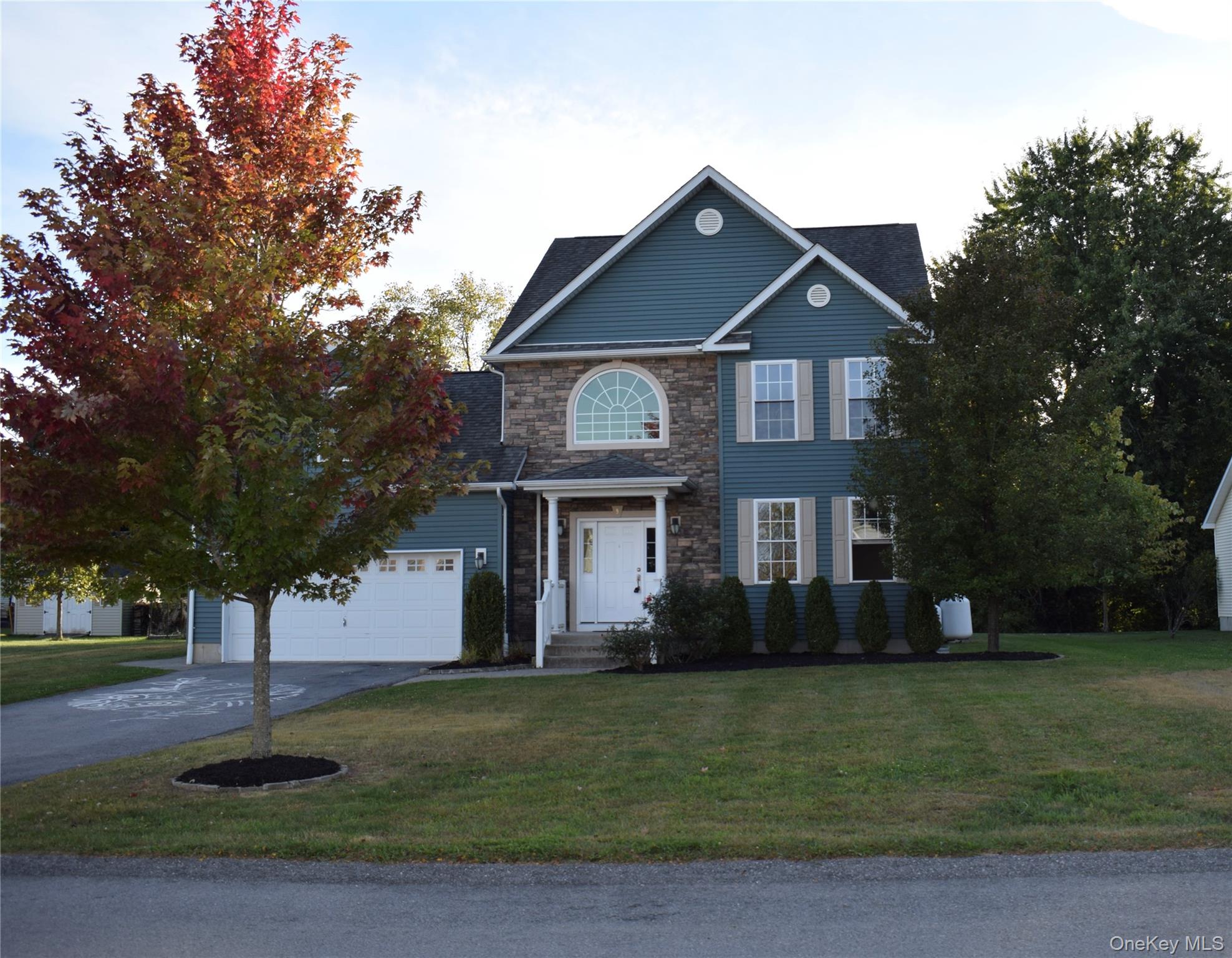 9 Alia Court Poughkeepsie, NY 12603 - Photo 3 of 37 a front view of a house with garden
