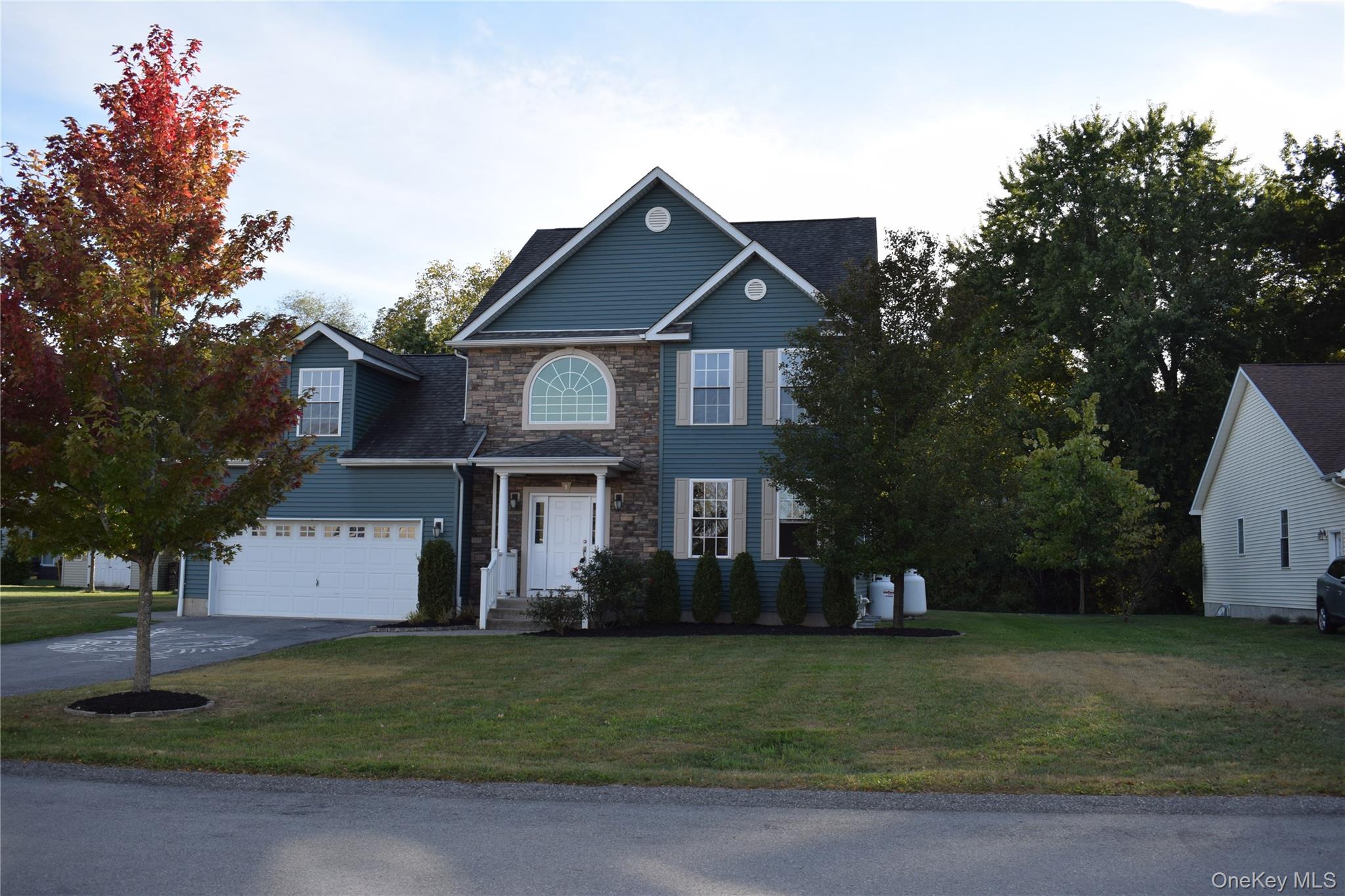 9 Alia Court Poughkeepsie, NY 12603 - Photo 5 of 37 a front view of house with trees and yard