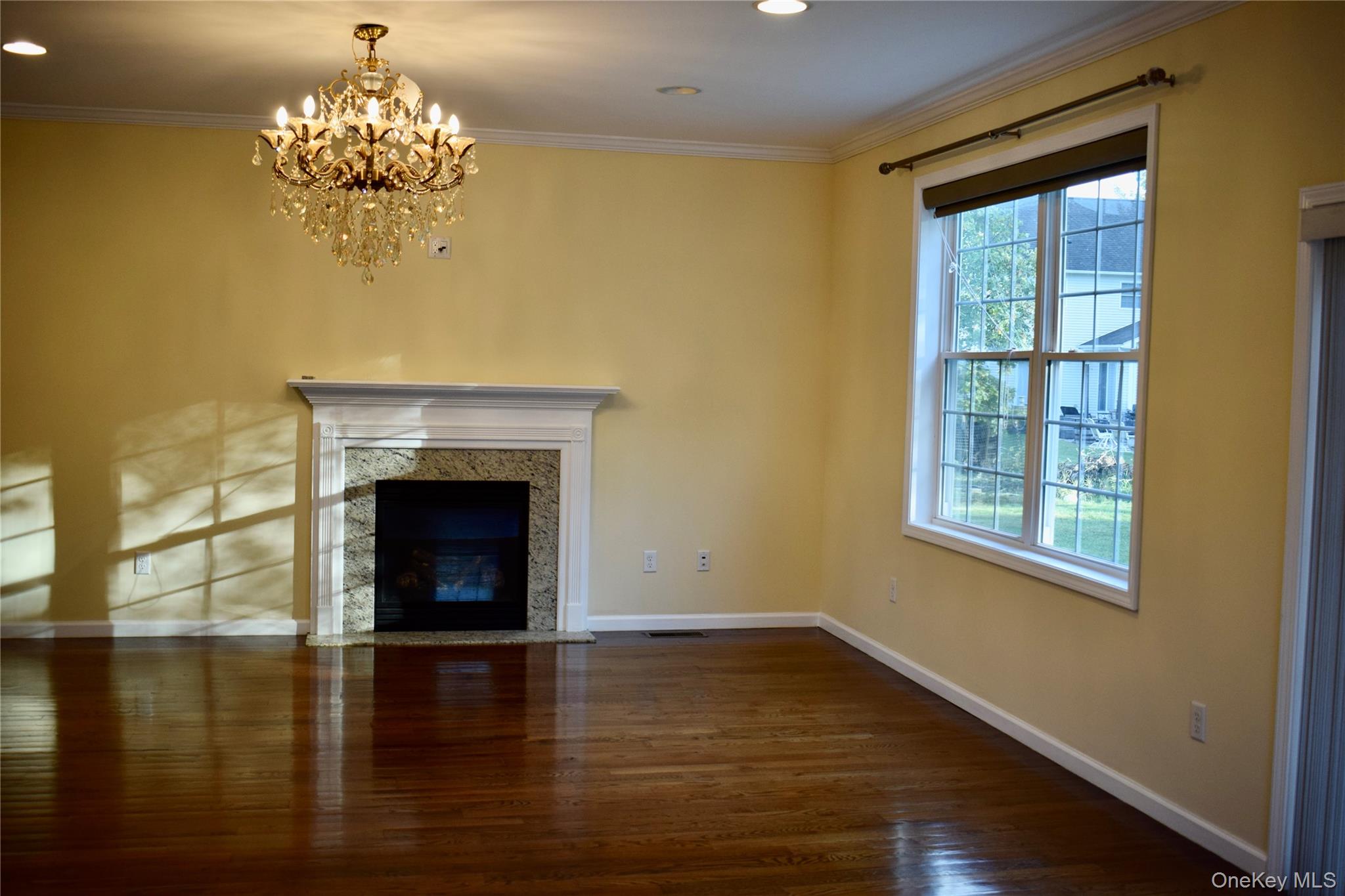 9 Alia Court Poughkeepsie, NY 12603 - Photo 9 of 37 a view of a livingroom with a fireplace window and wooden floor