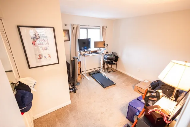 a view of a livingroom with furniture and a flat screen tv