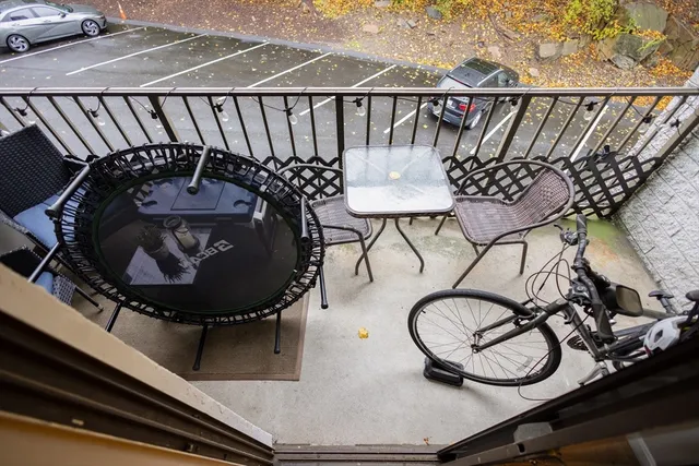 a view of balcony with furniture